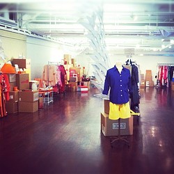 A person with a suitcase in a store.