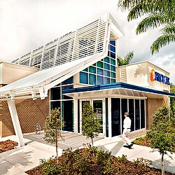 A person walking out of a building.