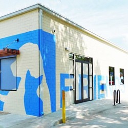 A building with blue and yellow paint.