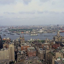 A city with a body of water in the background.