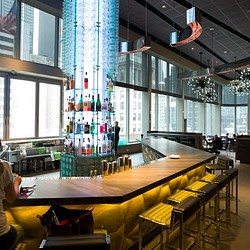 A room with a table and chairs.