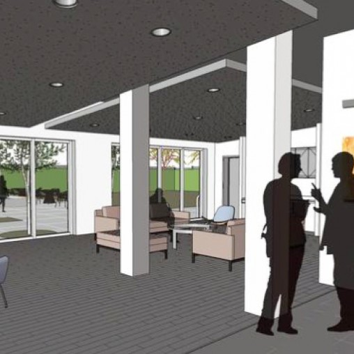 A room with glass doors and a person standing in front of it.