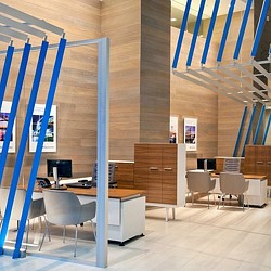 A room with a desk and chairs.