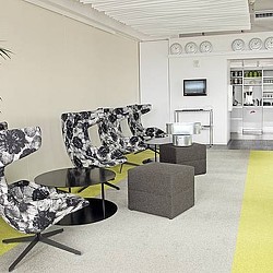 A living room with a couch and a table.