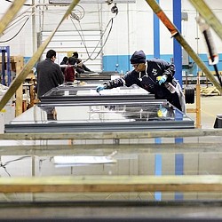 A man in a hockey uniform on a rink.