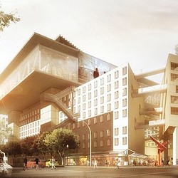 A large building with a street in front of it.