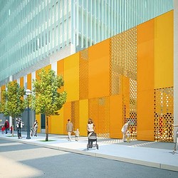 A group of people walking outside of a building.