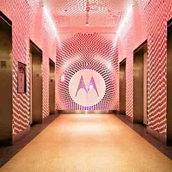 A hallway with a pink wall.