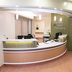 A room with a bed and a desk.