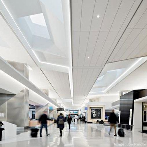 A group of people walking in a large building.