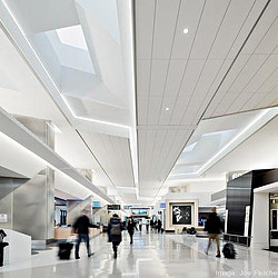 A group of people walking in a large building.