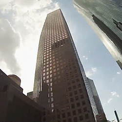 A tall building with a blue sky.