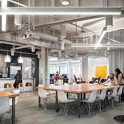 A group of people sitting at tables.