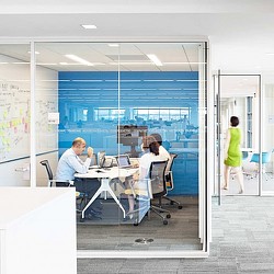 A man and a woman in an office.