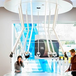 A couple of people in a room with a large glass wall.