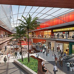 A mall with people and shopping carts.