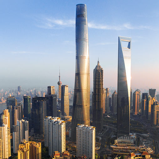 A couple of tall buildings in a city.