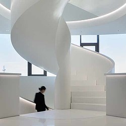 A person sitting on a staircase.