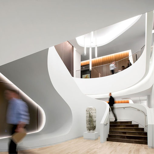 A staircase with a person walking up to it.