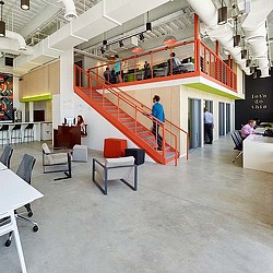 A room with people and tables.