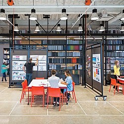 A group of people in a library.