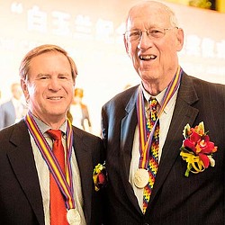 A man and a woman smiling.