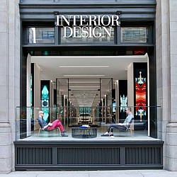 A group of people sitting outside a building.