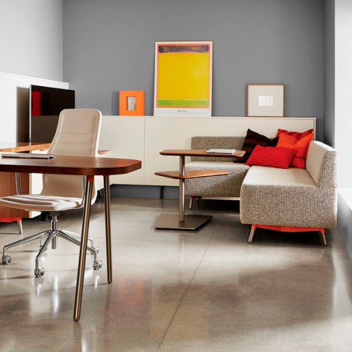 A room with a couch and a table.