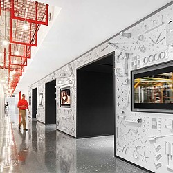 A person walking in a hallway.