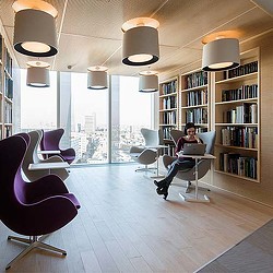 A person sitting in a library.
