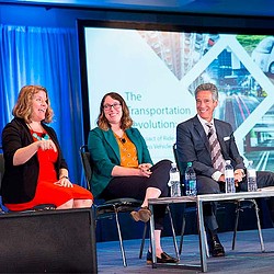 A group of people sitting on chairs.