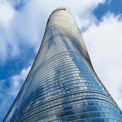 A tall building with a blue sky.