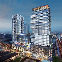 A high rise building with a sign.