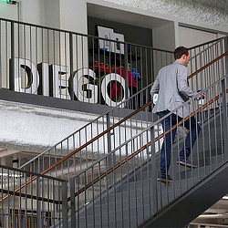 A man walking up a flight of stairs.