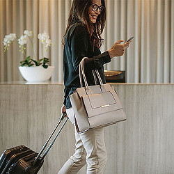 A woman with a bag and a purse.