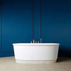 A white bowl with a metal tube.