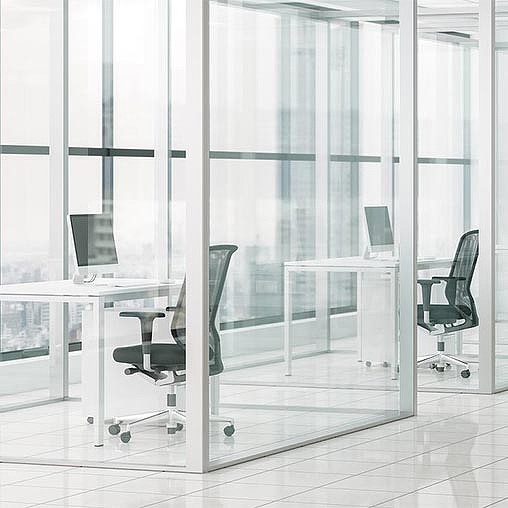 A room with a table chairs and a glass door.