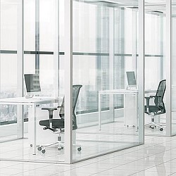 A room with a table chairs and a glass door.