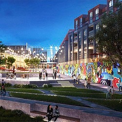 A group of people walking around a park in front of a building.