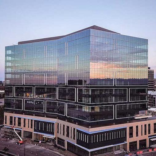 A large building with glass windows.