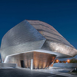 A large building with a curved roof.