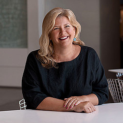 A woman sitting at a table.