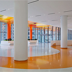 A large room with white pillars.
