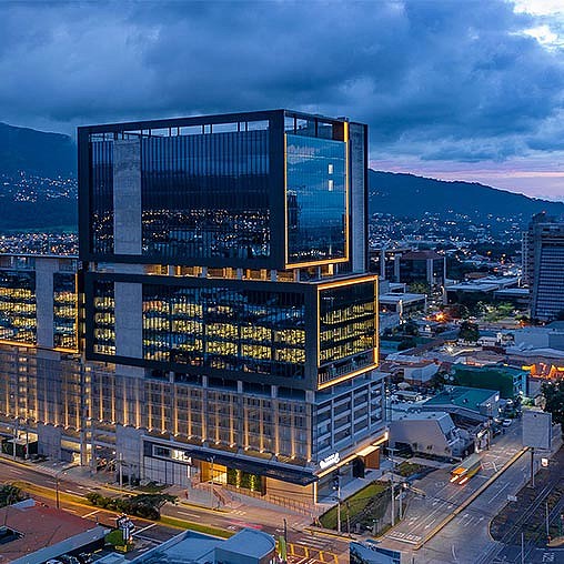 A tall building with a large screen.
