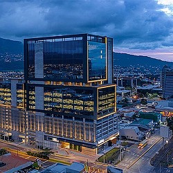 A tall building with a large screen.