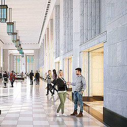 A group of people standing in a hallway.