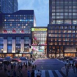 A group of people walking in a city.