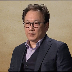 A man wearing glasses.