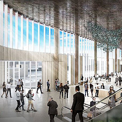 A group of people in a large building with columns and a large glass ceiling.