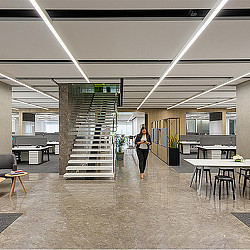 A person walking in a large room.